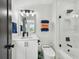 Bathroom featuring modern vanity, tiled shower with glass door, and contemporary fixtures at 12684 Willstatter Ave, Orlando, FL 32827