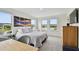 Spacious bedroom with a queen-sized bed, and large windows with water views at 12684 Willstatter Ave, Orlando, FL 32827