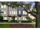 Charming townhome showcases manicured landscaping and a welcoming entryway at 12684 Willstatter Ave, Orlando, FL 32827