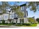 Three-story townhome boasts modern architecture and well-maintained landscaping at 12684 Willstatter Ave, Orlando, FL 32827