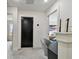 Modern hallway leads to bedroom, bathroom, and other living areas at 12684 Willstatter Ave, Orlando, FL 32827