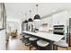 Modern kitchen features a large island with seating and stainless steel appliances at 12684 Willstatter Ave, Orlando, FL 32827