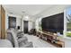 Entertainment room features a large screen and comfortable seating area at 12684 Willstatter Ave, Orlando, FL 32827