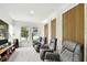 Relaxing living room featuring reclining chairs and view of the lake at 12684 Willstatter Ave, Orlando, FL 32827