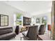 Modern living room with comfortable seating and stunning lake views at 12684 Willstatter Ave, Orlando, FL 32827