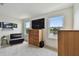 Living room with water view, featuring modern furnishings, large TV, and contemporary decor at 12684 Willstatter Ave, Orlando, FL 32827