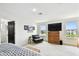Bright bedroom with a water view, with wood accents, contemporary furnishings, and decor at 12684 Willstatter Ave, Orlando, FL 32827