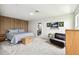 Bright bedroom with a decorative wood panel accent wall and modern furnishings at 12684 Willstatter Ave, Orlando, FL 32827