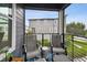 Cozy porch with seating overlooking the neighborhood with manicured landscaping at 12684 Willstatter Ave, Orlando, FL 32827