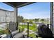 Relaxing porch with views of the lake and a BBQ grill, perfect for outdoor entertaining at 12684 Willstatter Ave, Orlando, FL 32827