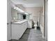 Clean bathroom with ample vanity storage, a full-sized mirror, and a shower/tub combo at 202 E South St # 5050, Orlando, FL 32801