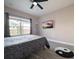 Relaxing bedroom featuring contemporary flooring, neutral paint, and bright window views at 202 E South St # 5050, Orlando, FL 32801