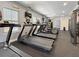 Well-equipped gym with multiple treadmills, TV, and various exercise equipment at 202 E South St # 5050, Orlando, FL 32801