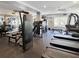 Spacious gym featuring an array of exercise machines, weights, and mirrored walls at 202 E South St # 5050, Orlando, FL 32801