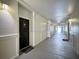 Well-lit hallway showcasing neutral walls and trim, leading to units within the building at 202 E South St # 5050, Orlando, FL 32801