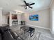 Comfortable living room featuring modern flooring, neutral paint, and an open layout at 202 E South St # 5050, Orlando, FL 32801