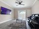 Bright living room with balcony access offering community views and contemporary furnishings at 202 E South St # 5050, Orlando, FL 32801