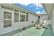 Outdoor patio with furniture under string lights for evening enjoyment, near windows at 3582 Milano Ave, Lakeland, FL 33803