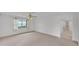 Spacious bedroom with neutral carpet, ceiling fan, and natural light at 3582 Milano Ave, Lakeland, FL 33803