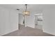 Dining room with stylish light fixture, and access to the kitchen at 3582 Milano Ave, Lakeland, FL 33803