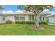 Manicured lawn and landscaping complement this home's inviting exterior at 3582 Milano Ave, Lakeland, FL 33803