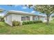 Well-maintained home exterior with neatly trimmed bushes and green grass at 3582 Milano Ave, Lakeland, FL 33803