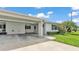 Exterior showcasing a well-maintained lawn and a convenient covered carport at 3582 Milano Ave, Lakeland, FL 33803