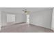 Open living room featuring neutral carpet, ceiling fan, and natural light at 3582 Milano Ave, Lakeland, FL 33803