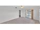 Open living room featuring carpet, a ceiling fan, and natural light at 3582 Milano Ave, Lakeland, FL 33803