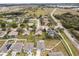 Aerial perspective reveals a community near lakes and highways, showcasing organized layouts and pleasing landscapes at 389 Singing Sands Cir, Lake Wales, FL 33859