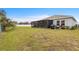 Spacious backyard with screened-in patio, perfect for outdoor entertaining at 389 Singing Sands Cir, Lake Wales, FL 33859