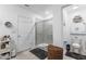 Bright bathroom featuring a glass-enclosed shower, toilet, vanity, hexagon shelf and modern decor at 389 Singing Sands Cir, Lake Wales, FL 33859