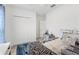 Cozy bedroom featuring an eye-catching zebra pattern throw, closet, and a ceiling fan at 389 Singing Sands Cir, Lake Wales, FL 33859