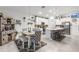 Bright dining area seamlessly connects to a modern kitchen and breakfast bar at 389 Singing Sands Cir, Lake Wales, FL 33859