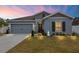 Charming single-story home with manicured lawn, rock garden and a two-car garage at 389 Singing Sands Cir, Lake Wales, FL 33859