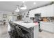 Kitchen provides a large island, stainless appliances, and seating at the breakfast bar at 389 Singing Sands Cir, Lake Wales, FL 33859