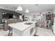 Kitchen boasts large island, stainless appliances and bright view to Gathering room and dining area at 389 Singing Sands Cir, Lake Wales, FL 33859