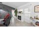 Cozy living room includes a decorative fireplace and neutral color palette at 389 Singing Sands Cir, Lake Wales, FL 33859