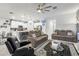 Living room has ceiling fan, view to kitchen and comfortable seating arrangement at 389 Singing Sands Cir, Lake Wales, FL 33859