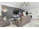 Living room has neutral color palette and wall-mounted media center at 389 Singing Sands Cir, Lake Wales, FL 33859