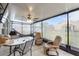 Inviting screened-in patio with ceiling fan, comfy seating, and open views at 389 Singing Sands Cir, Lake Wales, FL 33859