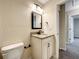 Updated bathroom features vanity with granite countertop and framed mirror at 4887 Sw 159Th Lane Rd, Ocala, FL 34473
