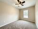 Bedroom featuring carpet, ceiling fan, and window at 4887 Sw 159Th Lane Rd, Ocala, FL 34473