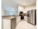 Modern kitchen with stainless steel appliances, granite countertops, undermount sink and ample cabinetry at 4887 Sw 159Th Lane Rd, Ocala, FL 34473