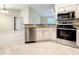 Well-equipped kitchen featuring stainless steel appliances, granite countertops and ample storage space at 4887 Sw 159Th Lane Rd, Ocala, FL 34473