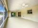 Spacious screened-in patio with ceiling fans at 4887 Sw 159Th Lane Rd, Ocala, FL 34473