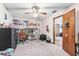 Bedroom with a loft bed, desk, and ceiling fan at 940 Fenton Ln # 7, Lakeland, FL 33809