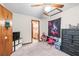 Bedroom with a ceiling fan and a view to the bathroom at 940 Fenton Ln # 7, Lakeland, FL 33809