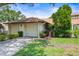 Charming single-story home features a well-manicured lawn and attached two-car garage at 940 Fenton Ln # 7, Lakeland, FL 33809