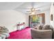 Comfortable living room featuring a ceiling fan and access to the outdoor balcony at 940 Fenton Ln # 7, Lakeland, FL 33809
